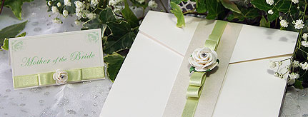 Isabella handcrafted wedding invitation featuring a white paper rose